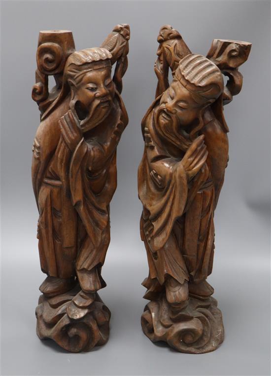 A pair of Chinese carved hardwood figures of sages height 53cm